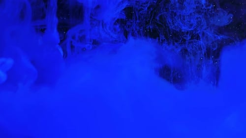 Deep Blue Ink Swirls on Black Background