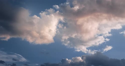 Clouds Drifting Across Blue Sky in Time-Lapse