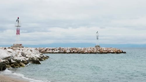 Rocky Coastline with Lighthouses on an Overcast Day