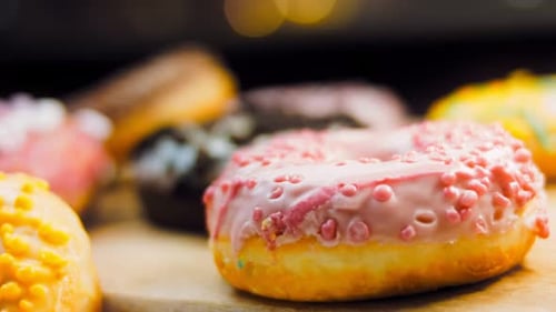 Delicious Donuts Covered in Icing in Restaurant Display