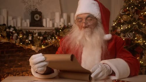 Santa Claus Reading Christmas List by the Fireplace