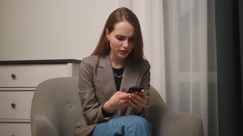 Happy Businesswoman Enjoy Success on Mobile Phone at Home Office