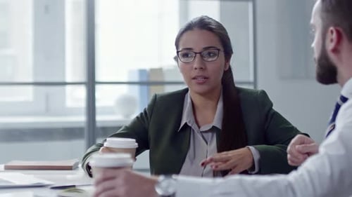 Business Lady Speaking with Colleague Over Coffee in Office