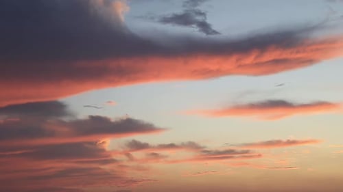 Dramatic Orange Sunset Sky with Moving Clouds