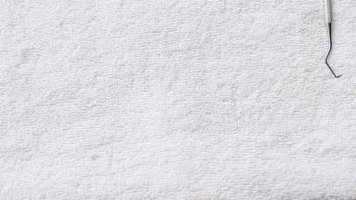 Dental Instruments on White Terry Cloth