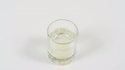 Effervescent Tablet Dissolving in Glass of Water