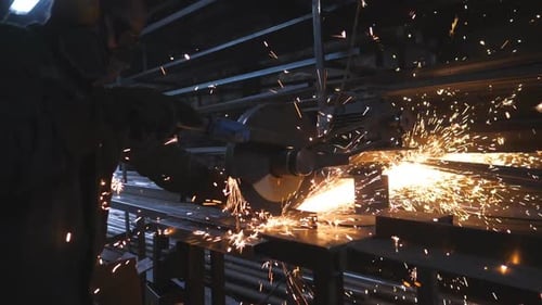 Worker Cutting Metal with Circular Saw
