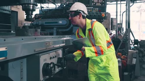 Smart Factory Worker Using Machine in Factory Workshop
