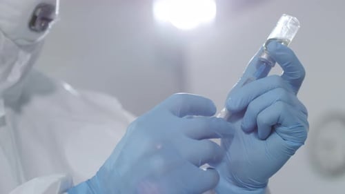 Medical Worker Preparing Vaccine in Hospital Setting