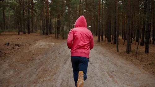 Man Running in Forest Woods Training.