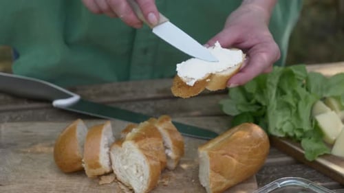Cream Cheese Sandwich Preparation on Wooden Board