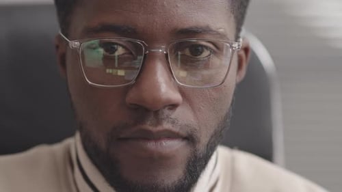 Close-Up of African-American Programmer in Eyeglasses