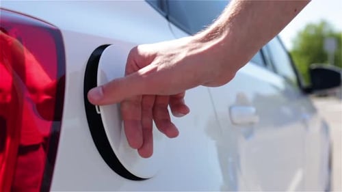 The Driver Opens The Fuel Cap Of The Car