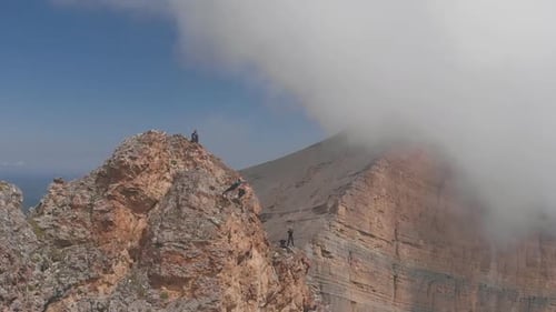 Drone Shot of a Thrill-seeker Jumps Off a Cliff with a Rope