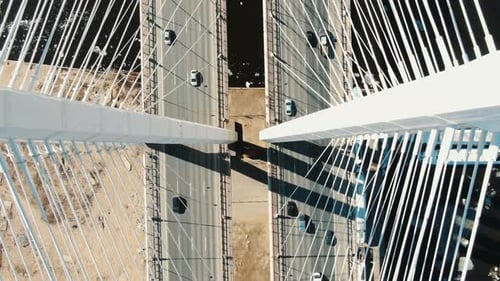 Drone Take Off Up Along the Cable-stayed Bridge Supports