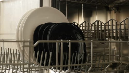 Close-up of dishwashing machine rack 3840X2160 4K 2160p 30fps UltraHD footage - Table dishware in