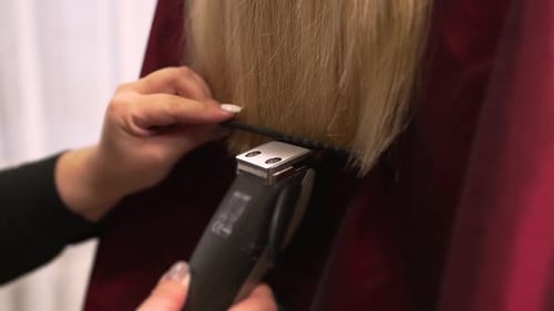 Blond Hair Getting Cut With Electric Clippers