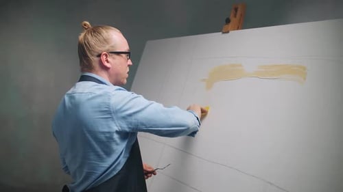 Artist Working on Painting in the Studio