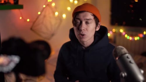 Young Adult Recording with a Microphone