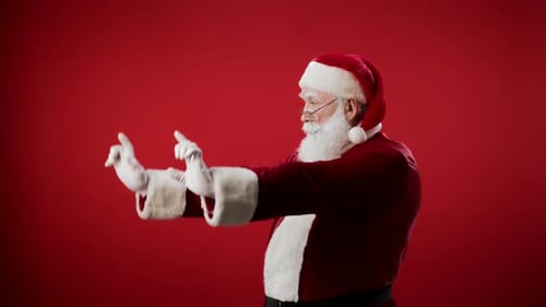 Santa Claus Pointing on Red Background