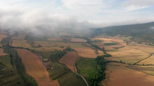 Aerial View of Rural Farmlands and Rolling Hills