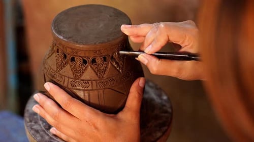 Artisan Hand Carving Designs on Pottery