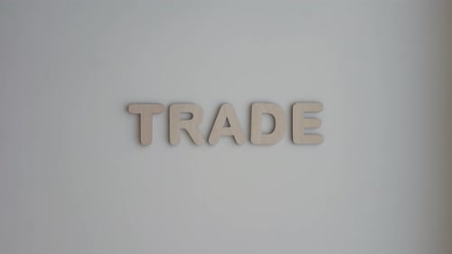 Wooden Letters Spelling the Word Trade