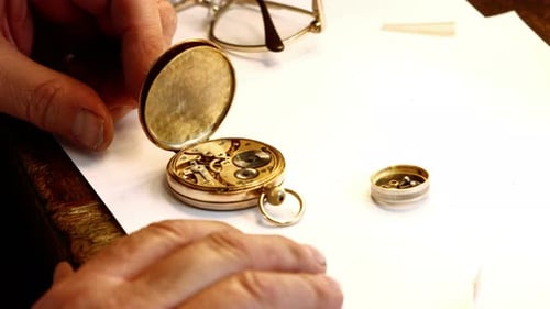 Watchmaker Repairs Antique Gold Pocket Watch Close Up