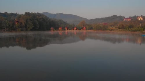 Misty Sunrise Over Lake at Alpine Countryside