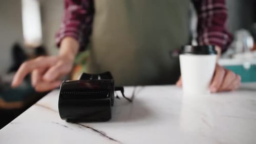 Contactless Payment Made Via Phone in Retail Setting