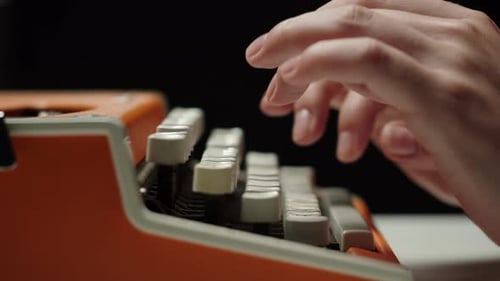 Human Hands Typing on Retro Typewriter Closeup Fingers Pressing Buttons of Oldfashioned Typewriter