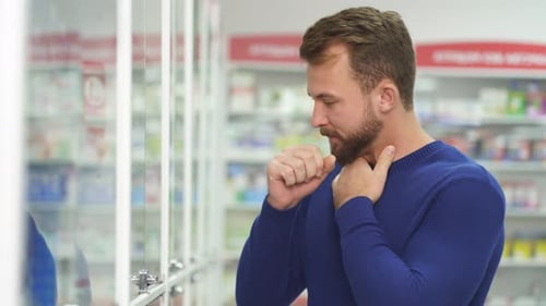 Diseased Man Is Suffering From Sore Throat, Need Some Medications in Pharmacy