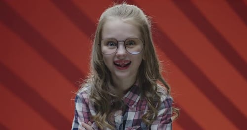 Child with Glasses in Studio Close Up