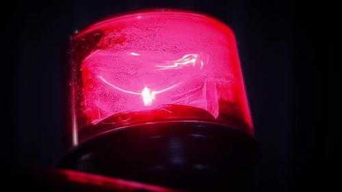 Rotating Red Emergency Light in the Dark