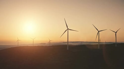 Modern Windmills Wind Turbines Blades Generate Green Energy Electricity in Field