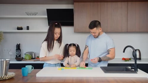 Family Enjoys Creative Time with Clay in Modern Kitchen