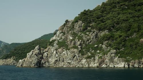 View of the rocky mountains in the open sea