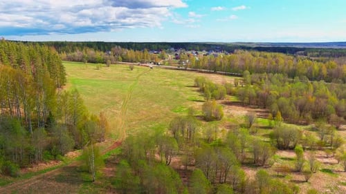Aerial View of Fields with Forests on a Spring Sunny Day a Magical Landscape with Treetops Lakes in