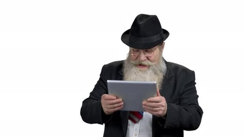 Senior Man Shocked by Tablet Content