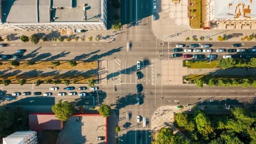 Top View of a Busy Regulated Intersection in the City Time Lapse of a Road