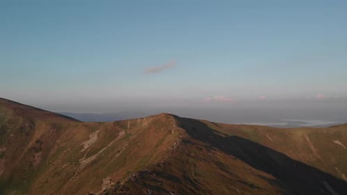 Mountain Peaks Under Blue Sky on Summer Day