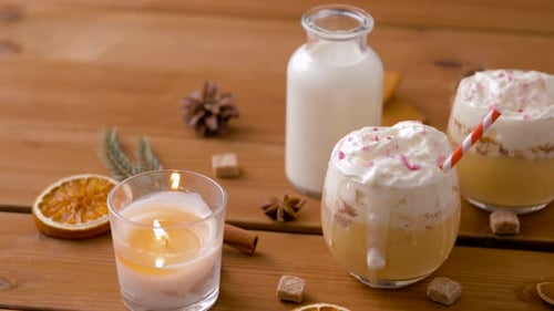 Glasses of Eggnog, Ingredients and Spices on Wood