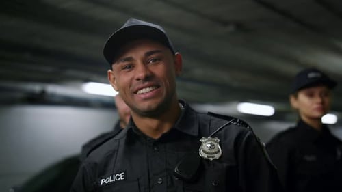 Smiling Police Officers in Dark Uniforms