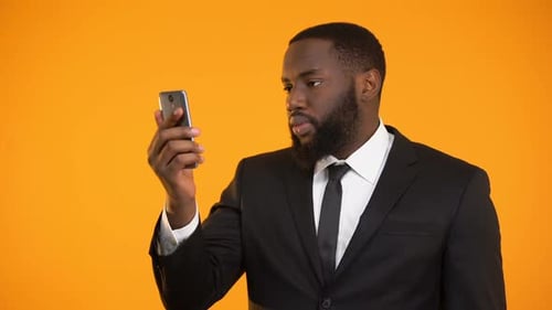 Man Receives Good News on His Phone