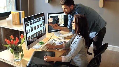 Professionals Collaborating on Design Project in Modern Office