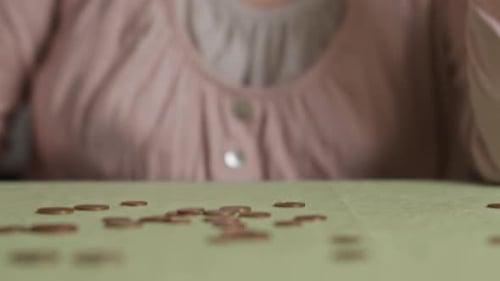 Distressed Woman Holding Head Over Money Troubles