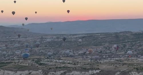 Aerial Cinematic Drone View of Colorful Hot Air Balloon Flying Over Cappadocia