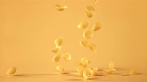 Super Slow Motion Pasta Rigate Dry Falls on the Table
