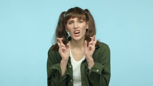 Woman Crossing Fingers for Good Luck