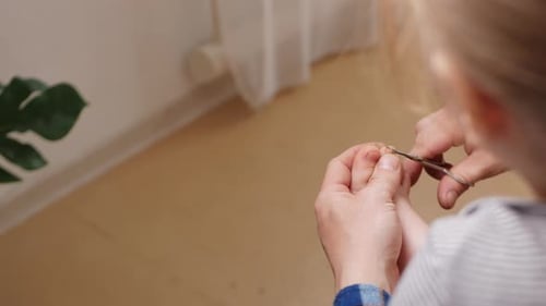 Trimming Child's Toenails Close Up at Home